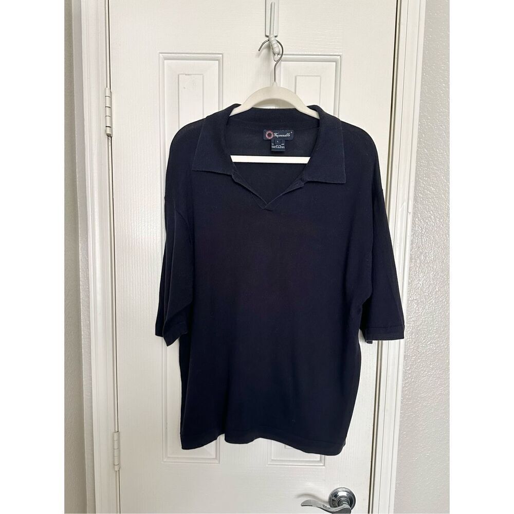 Faconnable men’s blue knit polo designed by Albert Goldberg ￼